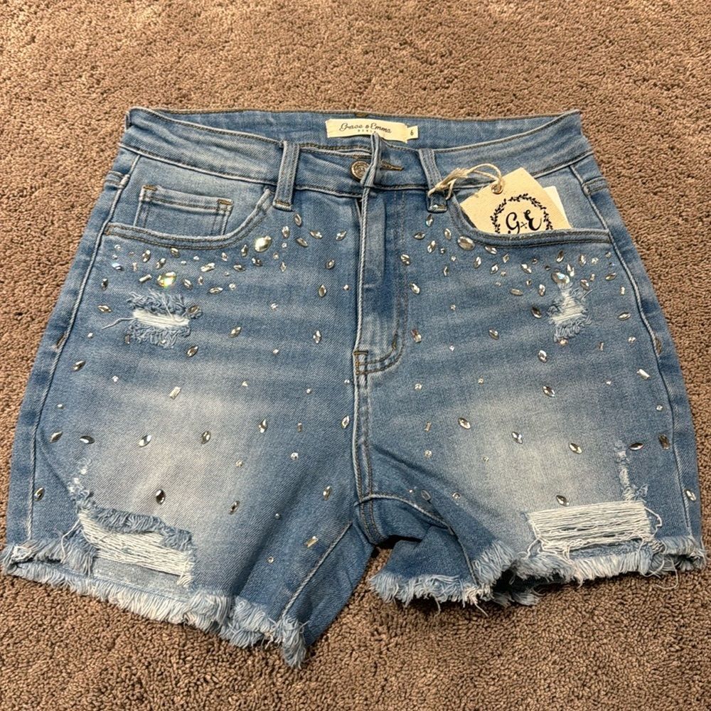 Denim jeweled shorts! With distressing and fray ! Size 6 with some stretch